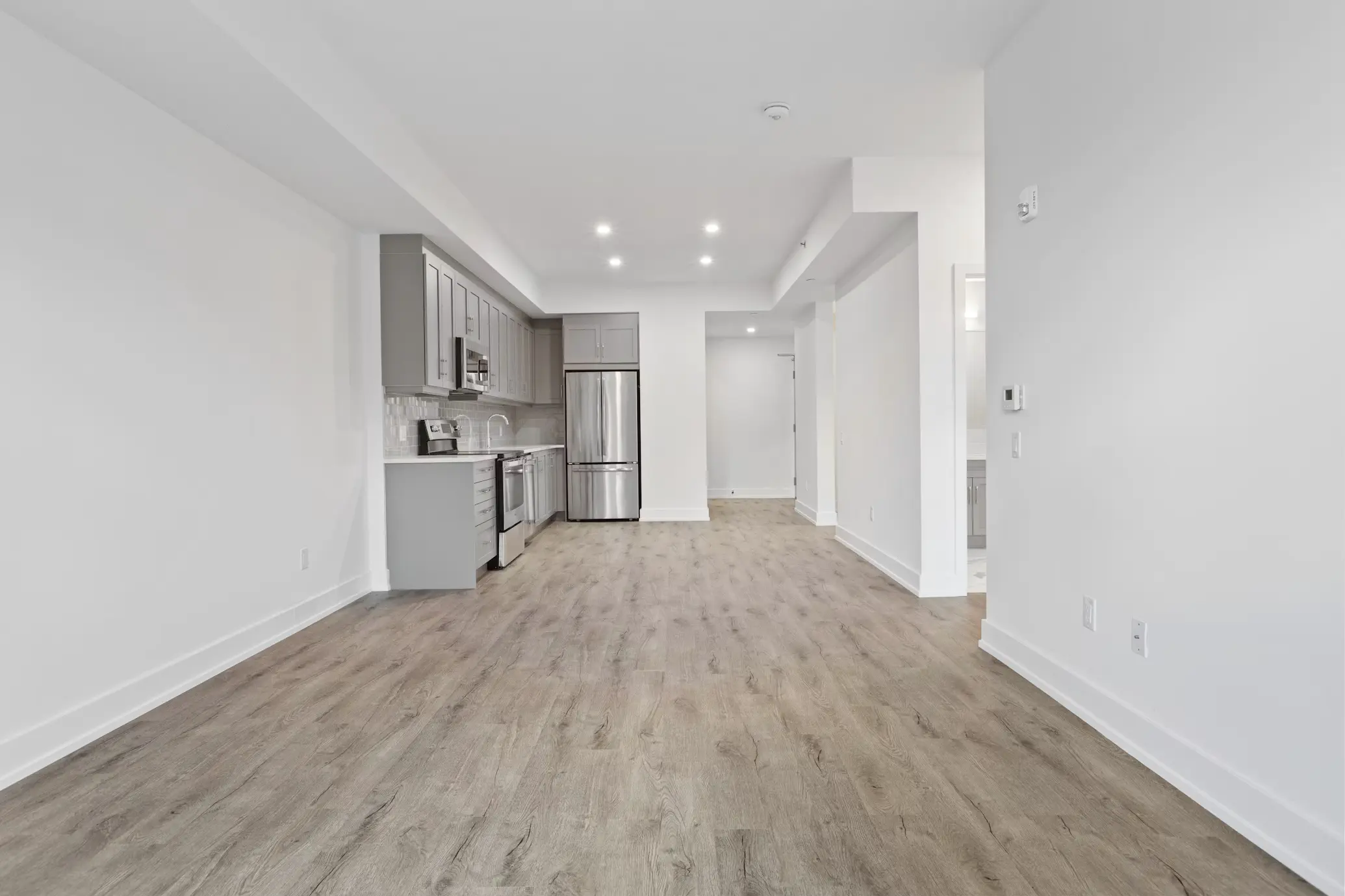 Newly installed hardwood-style flooring in a finished space
